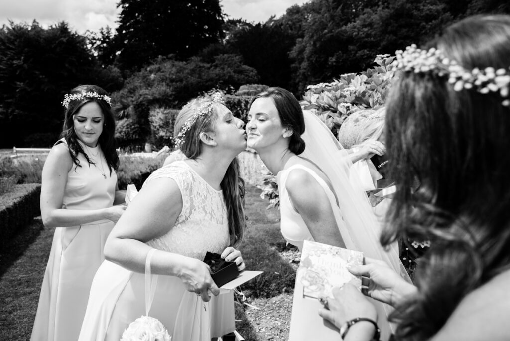 Black and white documentary photo of bride with bridesmaids Wedding Photographer Ottawa