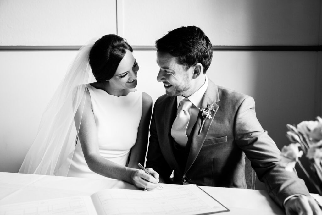 Bride and groom signing Wedding Photographer Ottawa