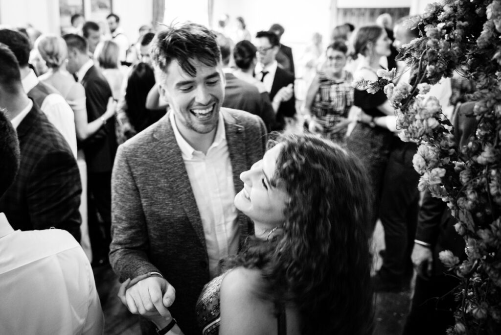 Wedding Photographer Ottawa Documentary Black and White Photo of Guests Dancing