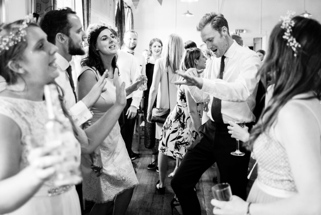 Wedding Photographer Ottawa Documentary Black and White Photo of Guests Dancing