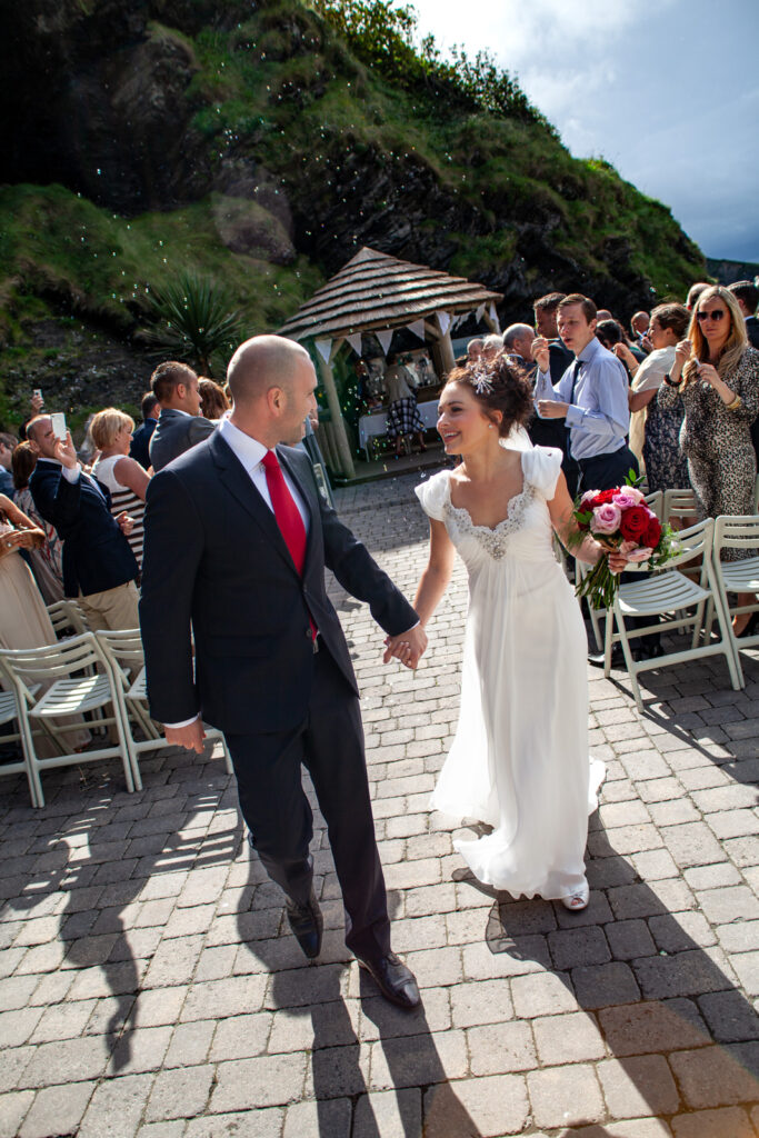 Bride and Groom walking down aisle at Beach Ceremony by wedding photographer ottawa Sara
