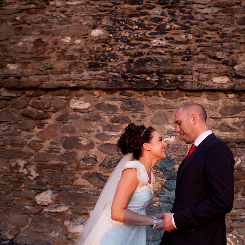 Couple Portrait against beach stone wall Wedding Photographer Ottawa