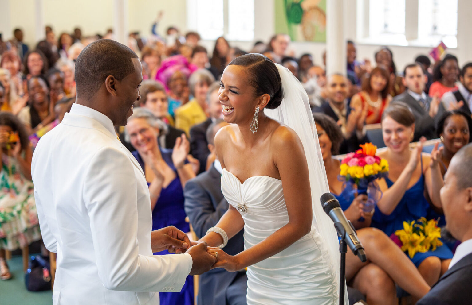 Couple laughing at the Church altar after saying their vows