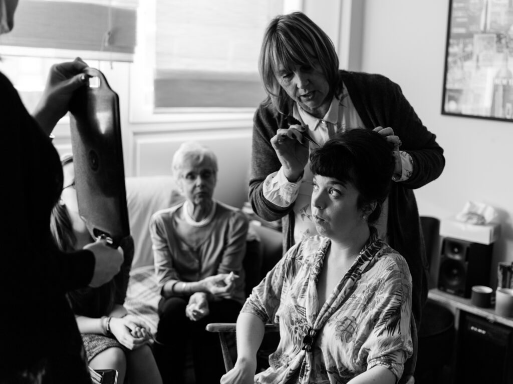 Bride having her hair done before the wedding ceremony by Ottawa Wedding Photographer Sara