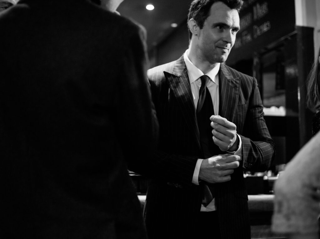 Guest in a pinstripe suite at the reception by wedding photographer ottawa Sara - documentary reportage