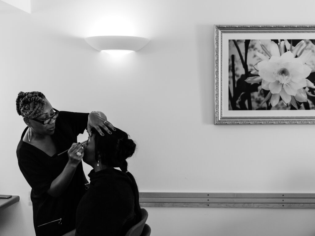 Black and white photo of Bride getting her make-up done by Ottawa Wedding Photographer Sara