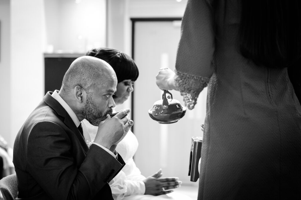 Buddhist tea ceremony with Bride and Groom by Ottawa Wedding Photographer Sara