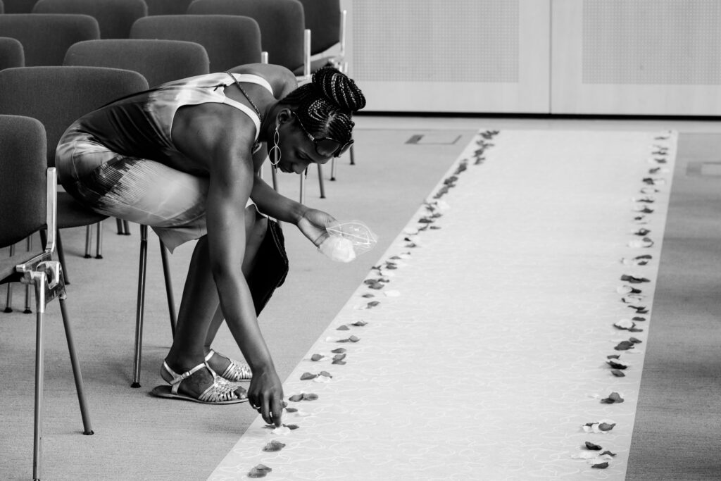 Laying rose petals in preparation for the ceremony - Ottawa Wedding Photographer Sara