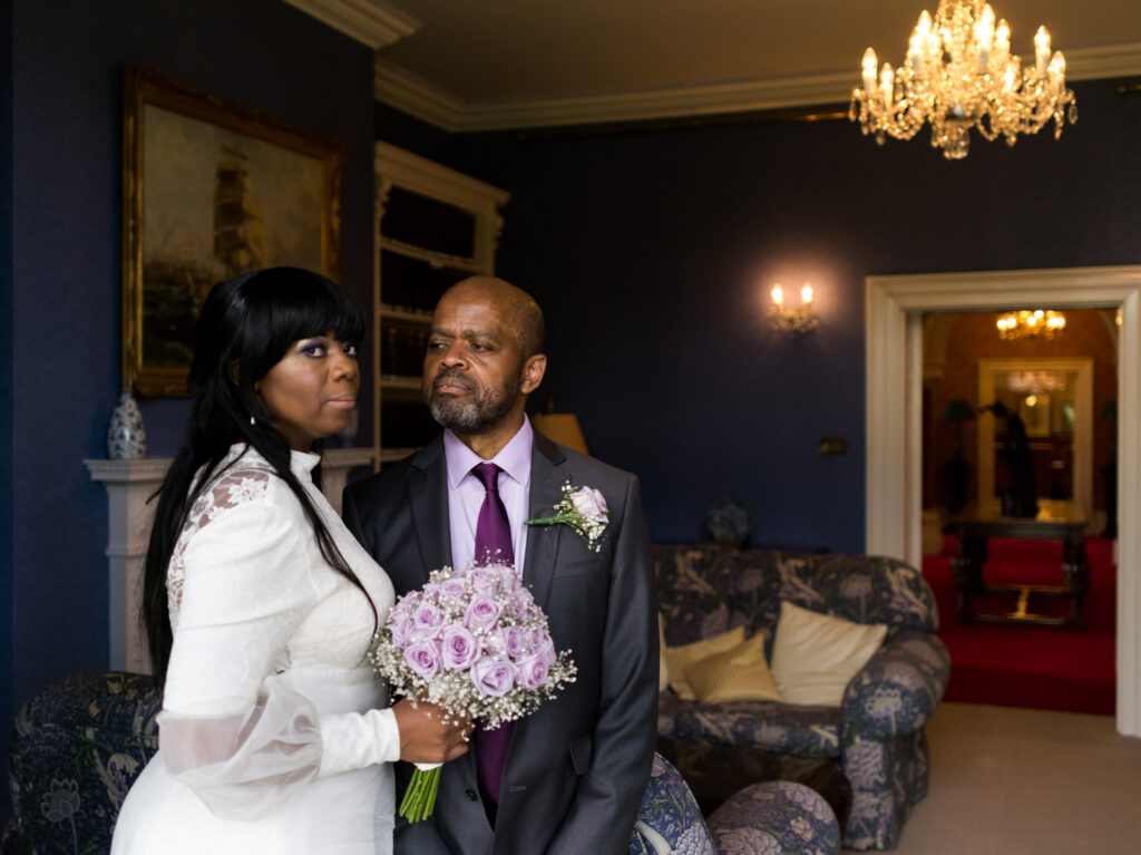 Portrait of Bride and Groom in luxurious manor home by Ottawa Wedding Photographer Sara