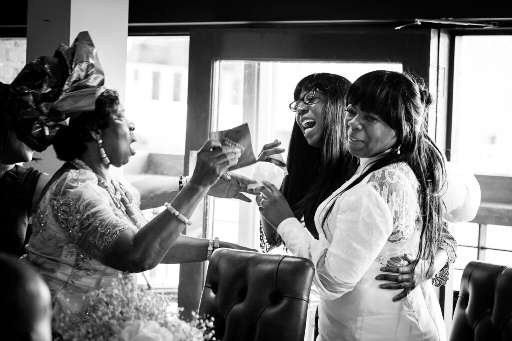 Mother of the bride and the bride and her sister at the reception by Ottawa Wedding Photographer Sara