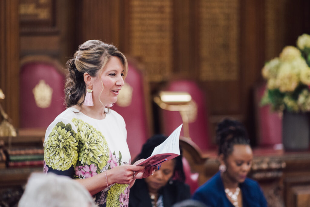 Guest giving a speech during the wedding ceremony by Ottawa Wedding Photographer Sara