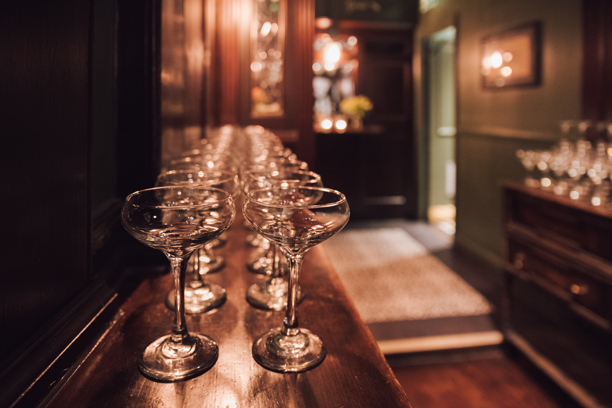 Detail of champagne glasses at reception - wedding inspiration. Photograph by Ottawa Wedding Photographer Sara