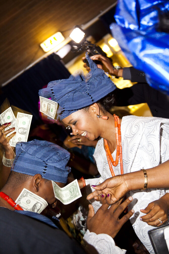Couple dancing with dollar bills. How much is a wedding photographer in Ottawa.