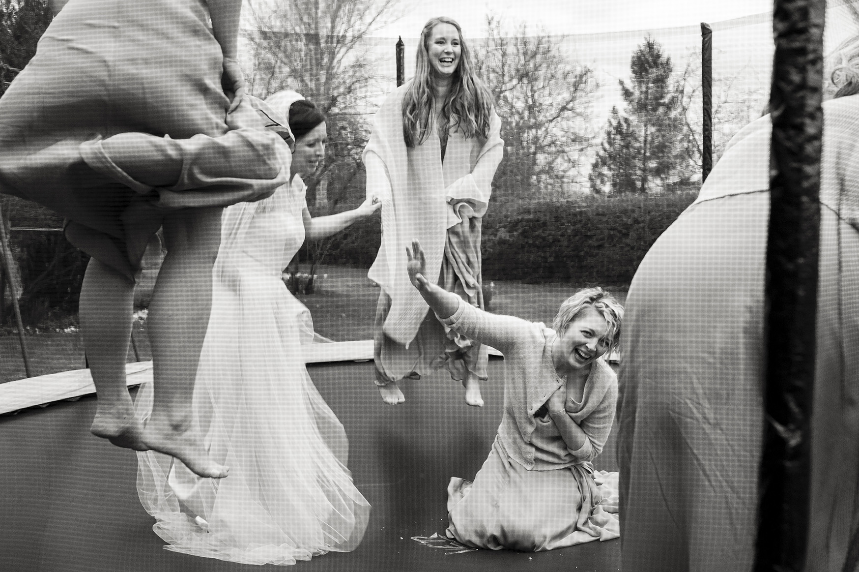 Unique wedding photographer Ottawa Sara SianTom04APR2015-329 ❥ Ottawa Wedding Photographer Bride and bridesmaids jumping on a trampoline at the wedding reception by documentary ottawa wedding photographer sara
