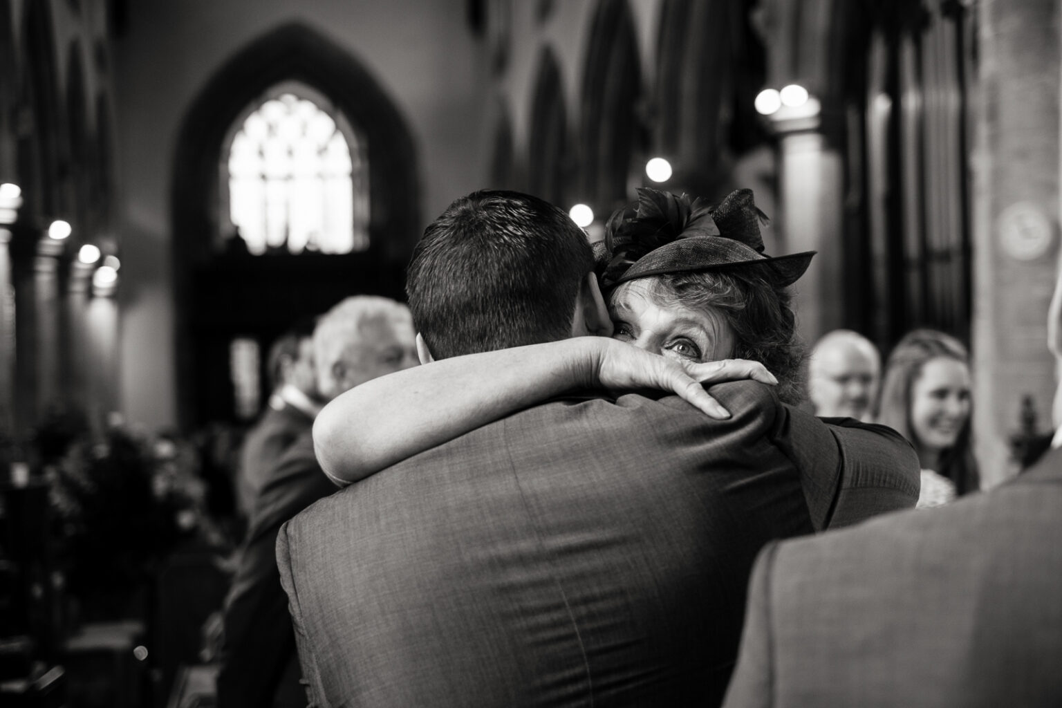 Mother embracing her son after the ceremony by documentary Ottawa Wedding Photographer Sara