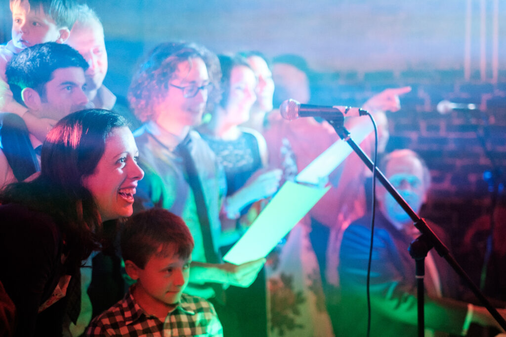 Guests singing at the reception by Ottawa Wedding Photographer Sara