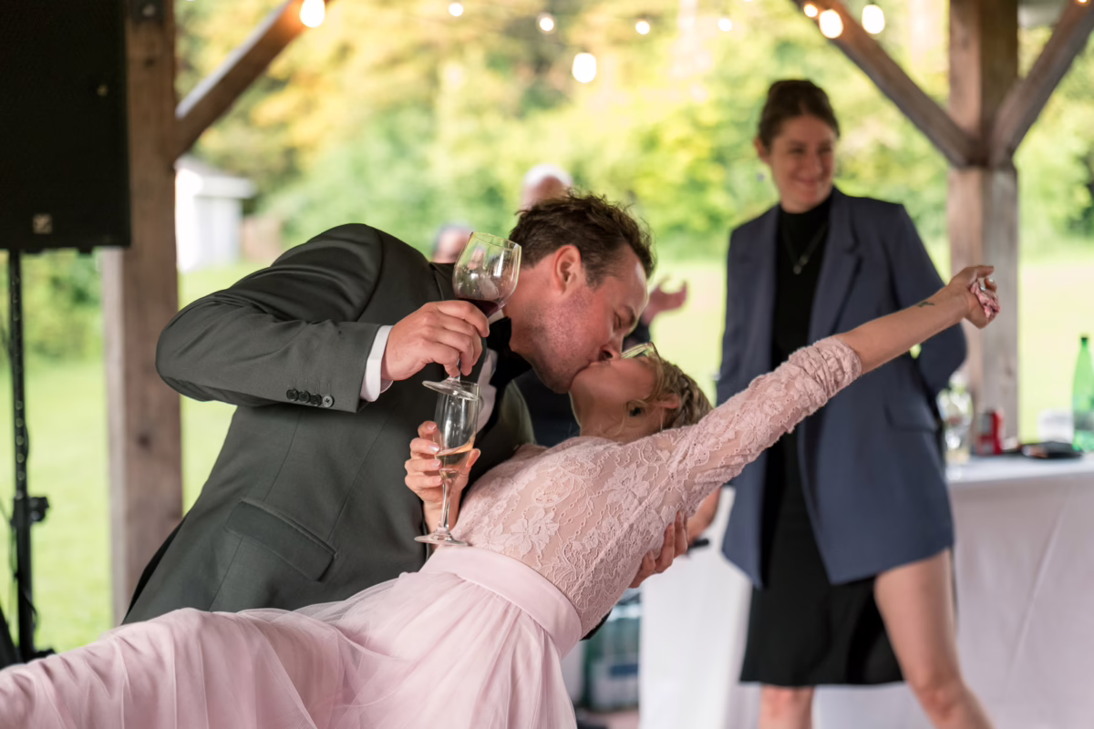 Ottawa Wedding Photographer Sara-1068352 ❥ Ottawa Wedding Photographer Candid of Bride and groom kiss and dip during reception by Ottawa Wedding Photographer Sara