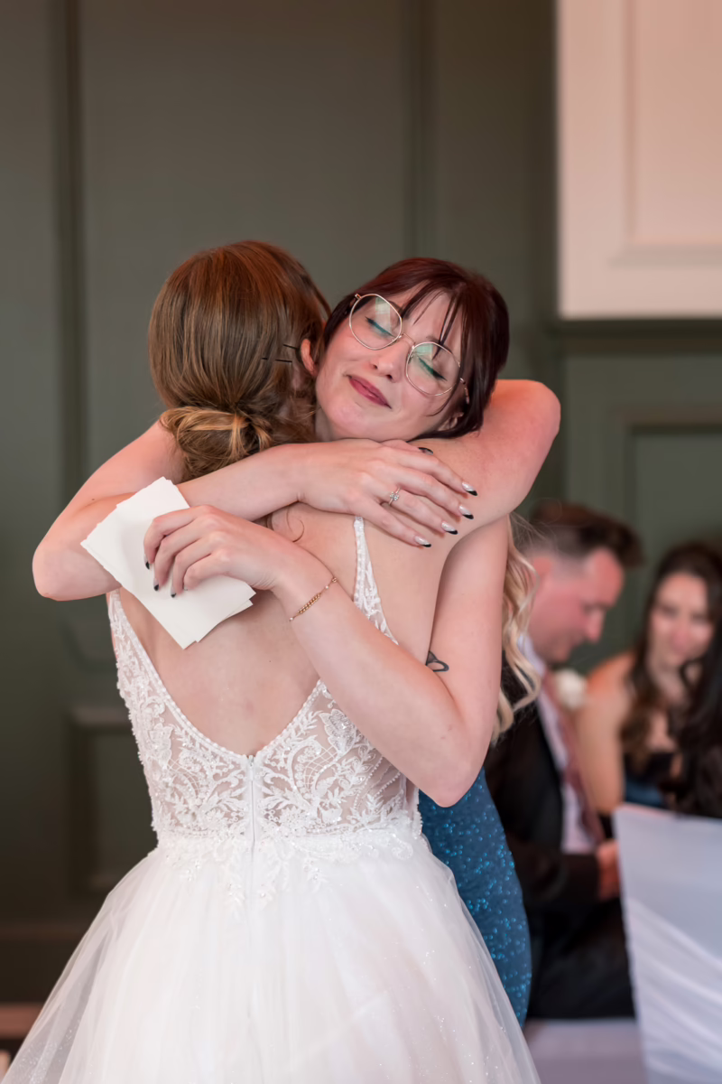 Ottawa Wedding Photographer Sara-1143155 ❥ Ottawa Wedding Photographer Bride and groom sister embracing by Ottawa Wedding Photographer Sara